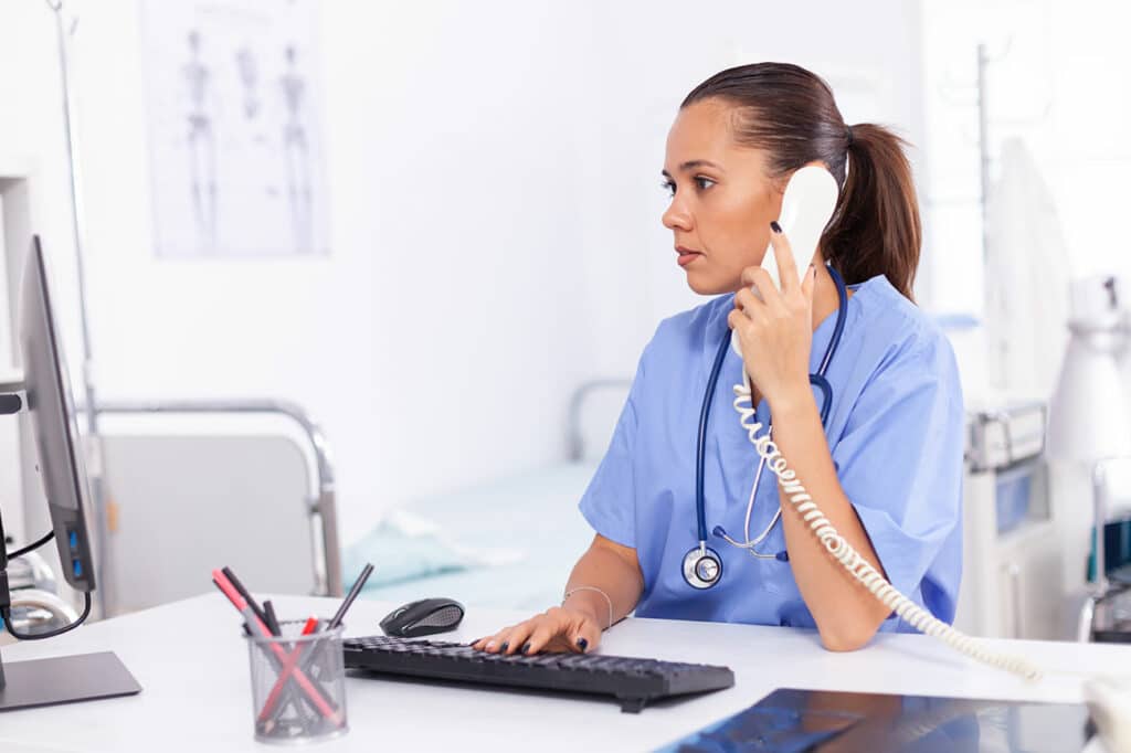 A lady doctor on a phone call.
